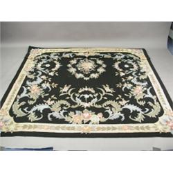 A modern black ground handmade woollen Abusson needlepoint carpet, 3.00 x 2.40m Est. 300/400...