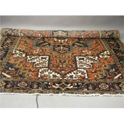 A modern red ground handmade woollen Persian Heriz carpet, 3.35 x 2.54m Est. 300/400...