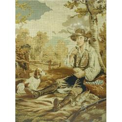 A large Victorian woolwork picture of a huntsman and his dog, in a maple frame Est. 200/300...