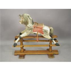A 1930's rocking horse Est. 200/300...