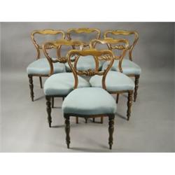 A set of six Victorian rosewood carved kidney back dining chairs, with stuff over seats Est. 500/...