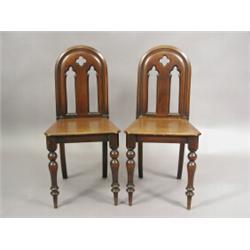 A pair of 19th century mahogany hall chairs Est. 100/150...