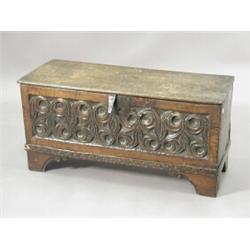 A small 17th century oak coffer with a carved front, 91cm high Est. 200/400...