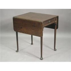 A George III small mahogany Pembroke table, with a drawer, on four turned club foot legs, 63 x 53...