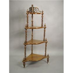 A Victorian walnut four tier corner whatnot with twist turned supports Est. 300/400...