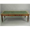 Image 1 : A Victorian mahogany library table, with four drawers either side, a central leather inset top an...
