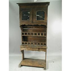 An 18th century Flemish carved oak and walnut glazed buffet, 224cm high Est. 400/600...