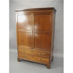 A small 19th century mahogany wardrobe with a pair of double panelled doors over two drawers, on...