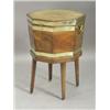 Image 1 : A George III octagonal mahogany wine cooler, with tapering sides and brass banding, the lid cross...