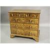 Image 1 : A walnut chest of two short and three long drawers with feather banding on bracket feet, basicall...