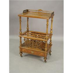 A Victorian walnut canterbury with fretcut decoration and a base drawer, 56cm wide Est. 600/800...