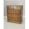 Image 1 : A George III mahogany chest of two short and three long drawers with a moulded caddy top on a pli...