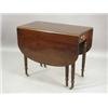 Image 1 : A mahogany drop leaf table with a reeded edge and two frieze drawers, raised on turned reeded leg...