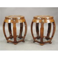 A pair of Chinese hardwood 'barrel' stands, 45cm Est. 300/350...