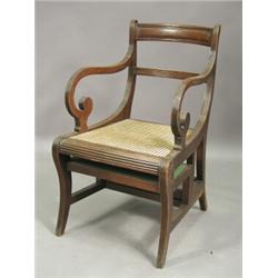 A Regency mahogany metamorphic library chair, in the style of Morgan and Sanders with a barback s...