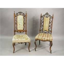A Victorian rosewood nursing chair with pierced and carved scroll work and twist turned columns,...