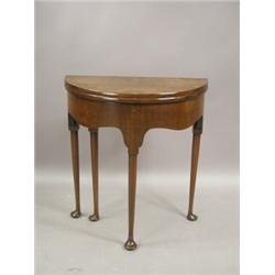 A reproduction walnut demi lune tea table, 68cm wide Est. 300/400...