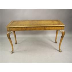 A Beresford & Hicks walnut serving table with a crossbanded top on cabriole legs, 137cm wide Est....