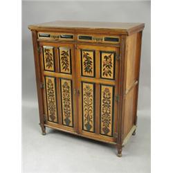 An Aesthetic cupboard (the centre section of a cabinet) with a pair of four panelled doors, ea...