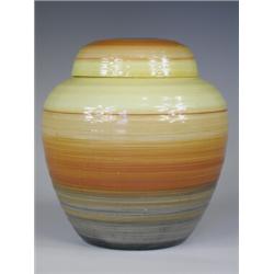 An early 20th century Shelley ginger jar, decorated with bright concentric bands against a rib...
