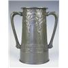 Image 1 : A Tudric pewter two handled tankard, decorated with sinuous stylised trees, and a banded motto...