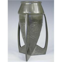A Liberty pewter vase with relief stylised foliate decoration, designed by Archibald Knox, str...
