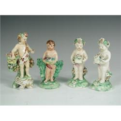 Three Derby 18th century figures of putti, each with a basket of flowers and a similar pottery...