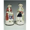 Image 1 : Two 19th century Yorkshire pottery figures of an oriental man and woman, (one unglazed, both w...