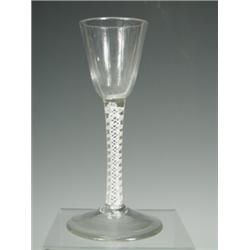 A George III air twist wine glass, with a bell shaped bowl on a domed folded foot, 16.5cm high...