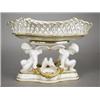 Image 1 : A 19th century Minton porcelain table centrepiece, modelled as a lozenge shaped basket support...