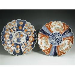 Two Imari dishes, with scalloped edges, painted in rust and blue with flowers, 31cm diameter<b...