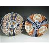 Image 1 : Two Imari dishes, with scalloped edges, painted in rust and blue with flowers, 31cm diameter<b...