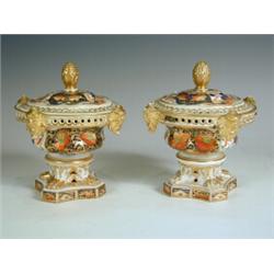 A pair of early 19th century Derby pastel burners with covers in the Imari palette, (one lid r...