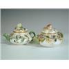 Image 1 : Two Minton miniature teapots with sprig foliage work, 5cm Est. 200/250...