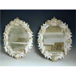 A pair of Dresden porcelain Girandoles, with floral biscuit work, each 42cm Est. 200/250...
