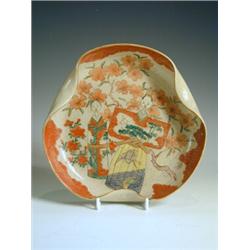 A Japanese Satsuma dish, decorated with dolls, signed by artist/potter, with a label: 'Worcest...