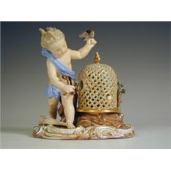 A Meissen figure of a girl putting birds in to a case, blue crossed swords mark and impressed...