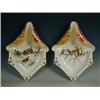 Image 1 : A pair of pottery wall plaques painted with birds Est. 150/200...