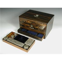 A Victorian coromandel toilet box with an inlaid mother of pearl escutcheon and plate, opening...
