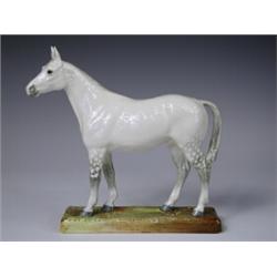 A Royal Doulton model of a dapple grey horse on a naturalistic ground and rectangular base, HN...