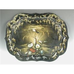 A Victorian papier mache tray of shaped form, with painted bird and floral sprays and rocaille...