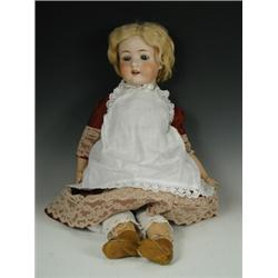 An Ernst Heubach bisque headed doll, with a wood and composition jointed body, marked koppelsd...