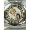 Image 1 : A cut glass scent bottle, the screw lid with silver and ivory mounts and an enamelled portrait...