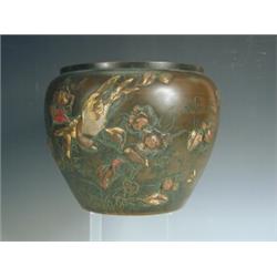 A Japanese bronze jardiniFre, with relief moulded flower and bird decoration, 18.5cm high E...