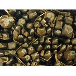 A box containing approximately 220 iron stamps Est. 400/600...
