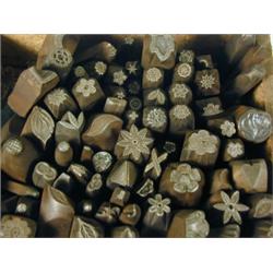 A box containing approximately 74 iron stamps, of larger gauge Est. 150/200...