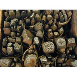 A box containing approximately 131 iron stamps Est. 250/300...