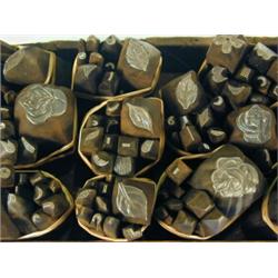 A box containing approximately 140 iron stamps Est. 280/320...