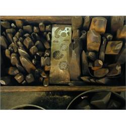 A box containing approximately 130 various iron stamps Est. 260/320...
