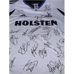 A 2002/03 season signed Tottenham Hotspur F.C. football shirt, thirty signatures including Rob...
